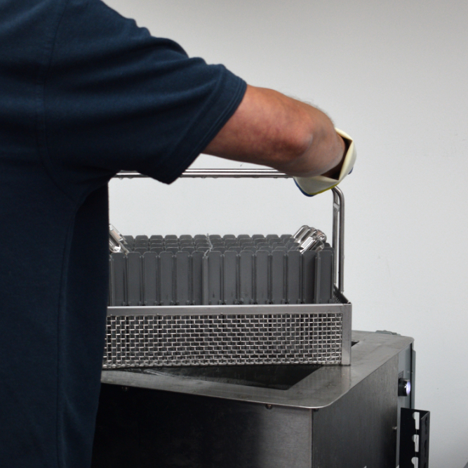 Components being removed from the ultrasonic cleaner